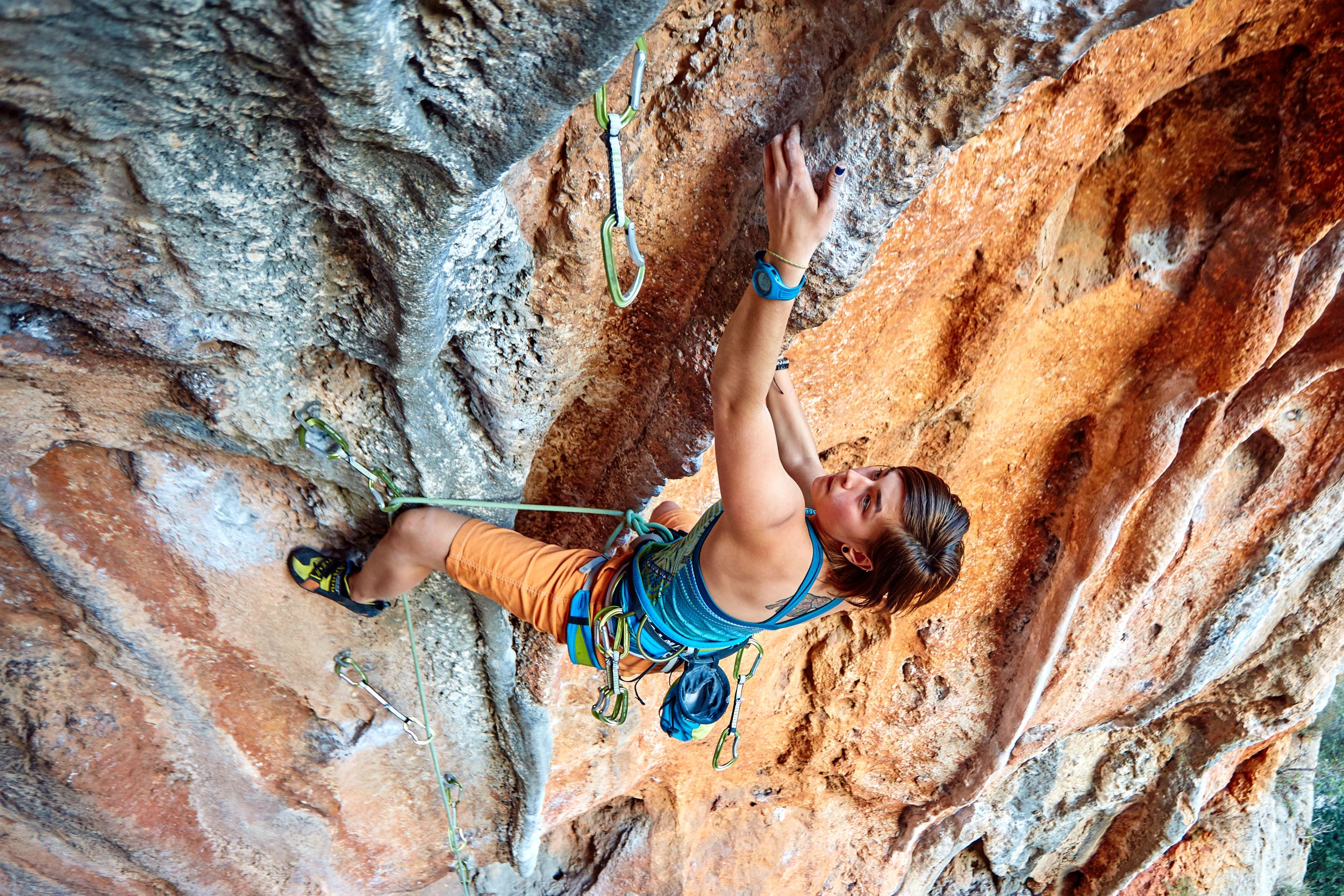 A woman rock climbing.