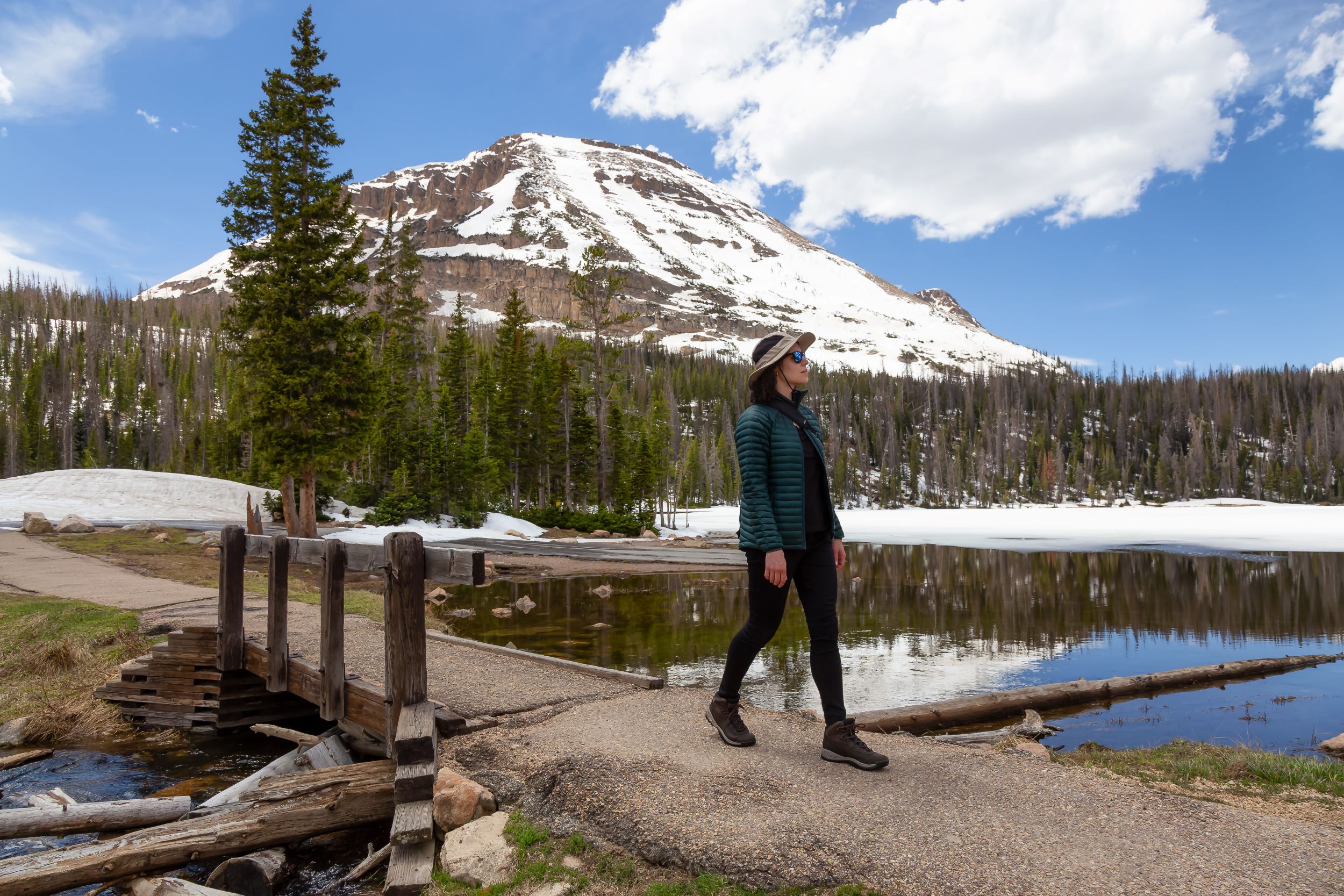 A woman walking a Mirror Lake.