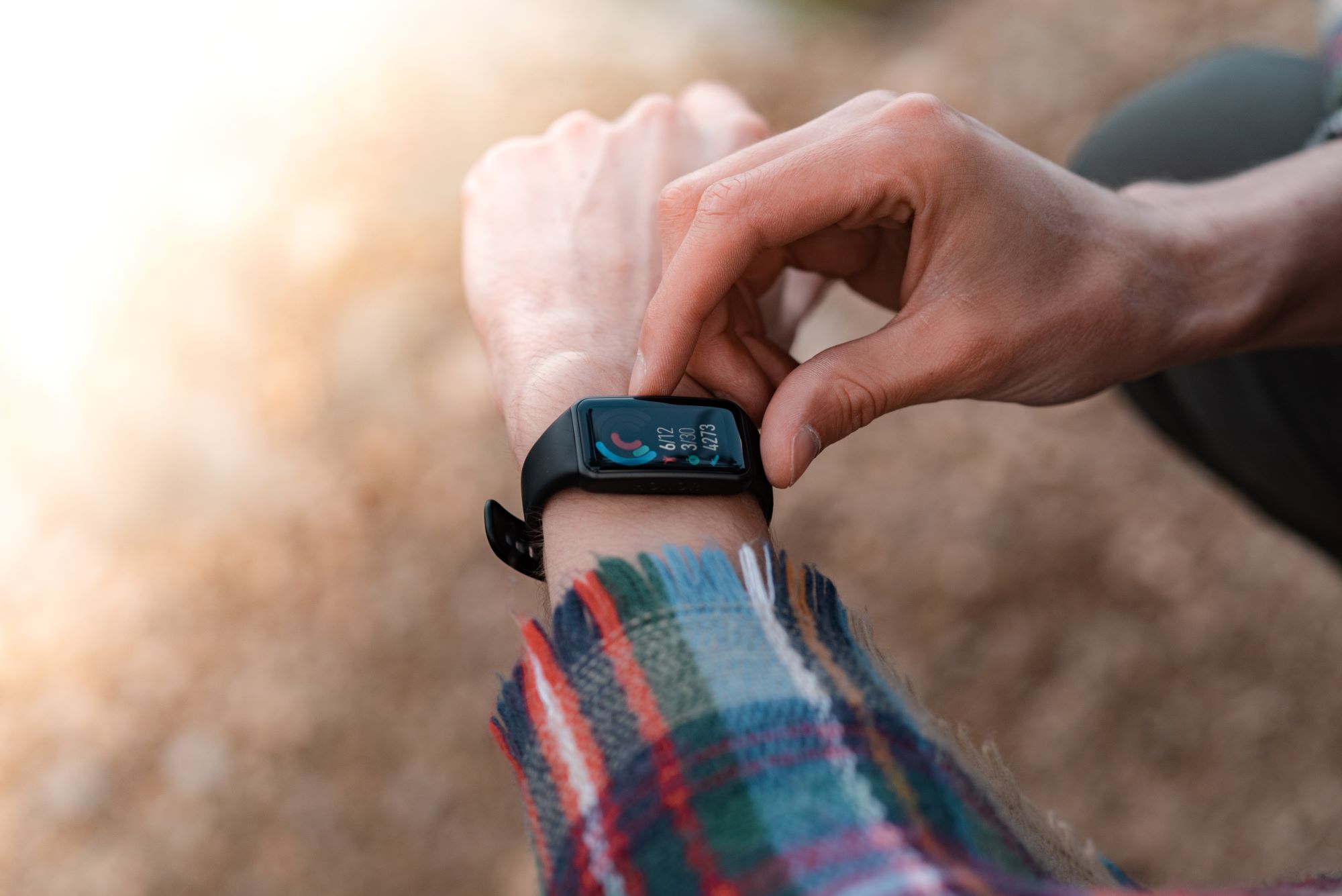 A hiker checking his pulse.