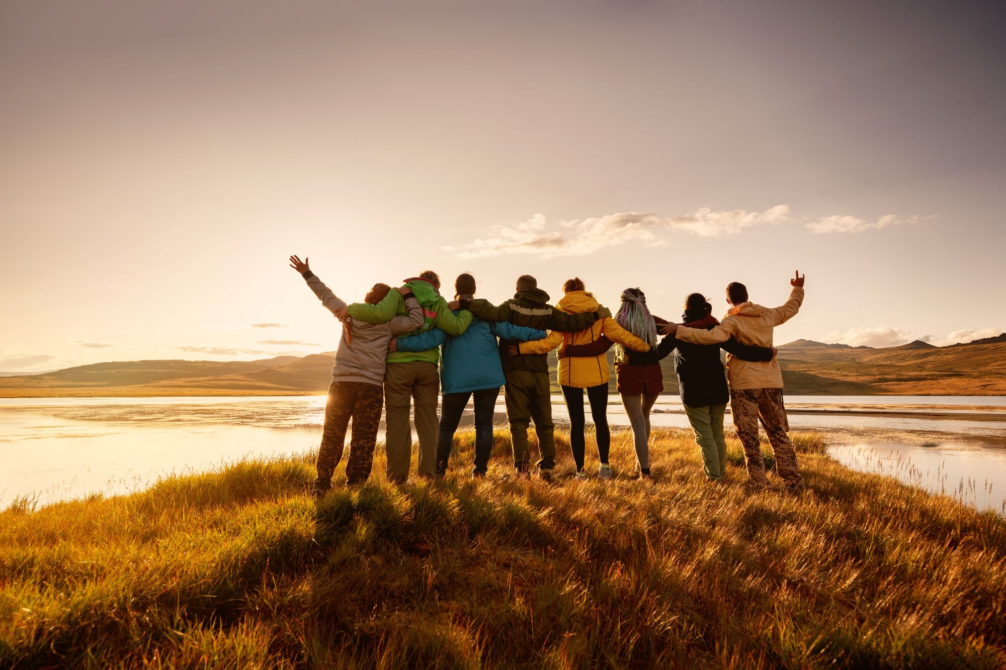 A group of hikers at sunset.