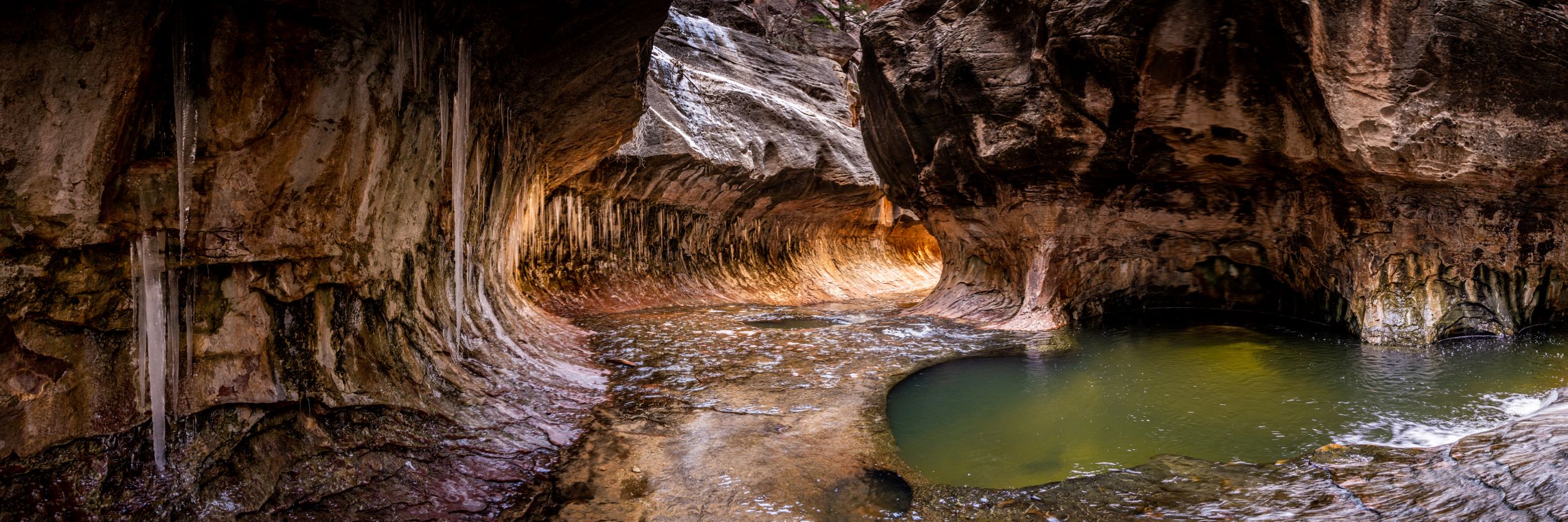 Icicles hanging from the sides of The Subway in Zion National Park.